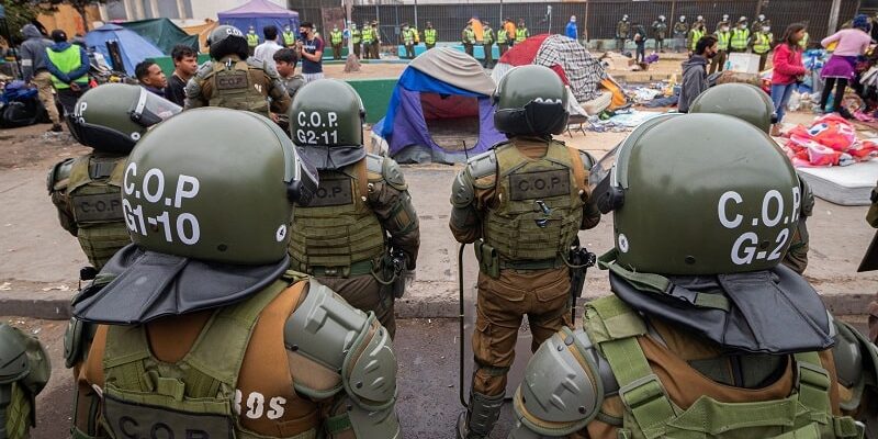 Policía de Chile investiga quema de pertenencias de migrantes